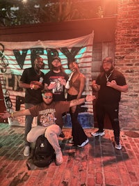 a group of people posing in front of a banner