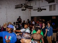 a crowd of people standing in a room